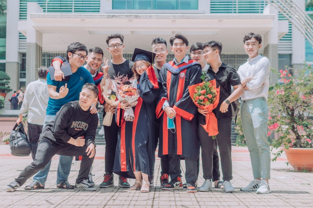 group-of-people-standing-on-gray-concrete-floor-during-daytime-xapvddtcpkc